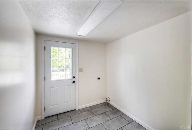 730 Stuart St, Lynchburg, VA 24501 - doorway to outside with a textured ceiling, baseboards, and light tile patterned floors
