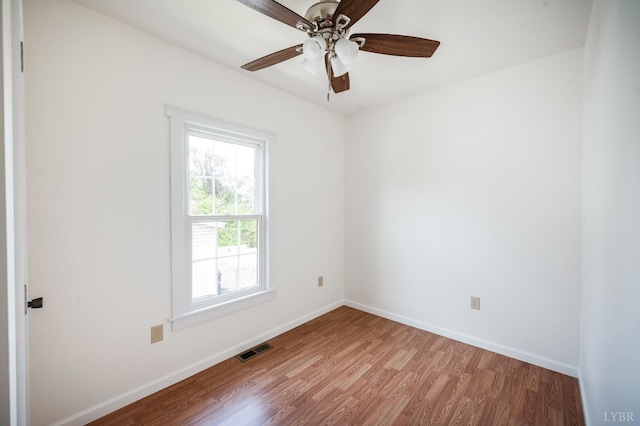 730 Stuart St, Lynchburg, VA 24501 - spare room featuring wood finished floors, baseboards, and ceiling fan