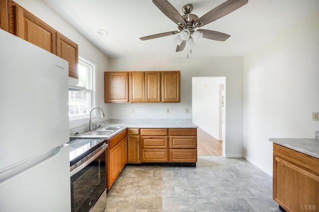 730 Stuart St, Lynchburg, VA 24501 - kitchen with freestanding refrigerator, electric range, a sink, ceiling fan, and baseboards