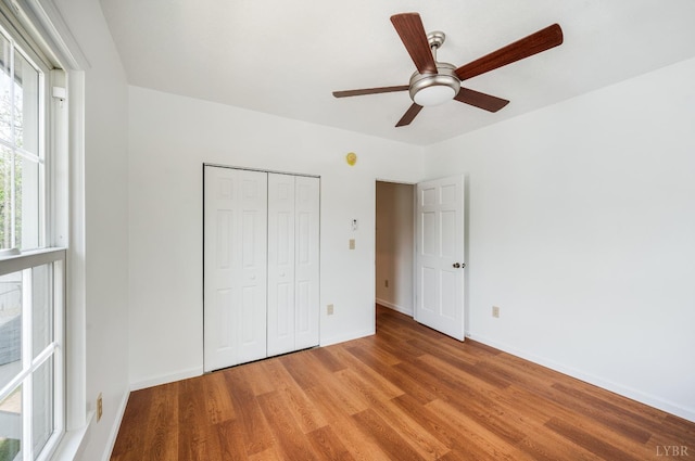 730 Stuart St, Lynchburg, VA 24501 - unfurnished bedroom with light wood finished floors, baseboards, a closet, and ceiling fan