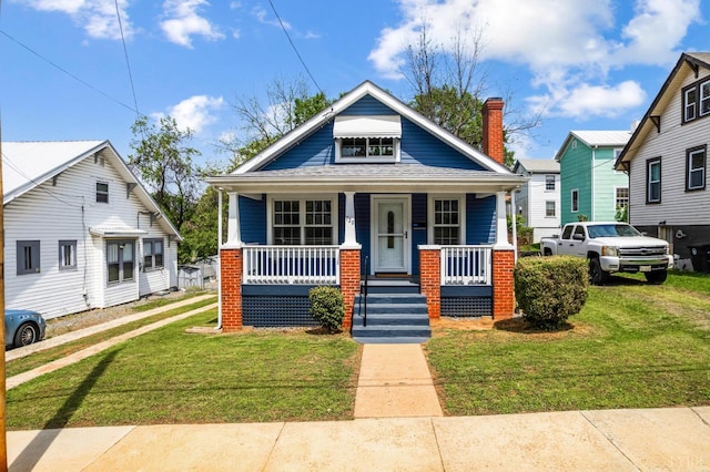 730 Stuart St, Lynchburg, VA 24501 - bungalow-style home with a porch and a front lawn