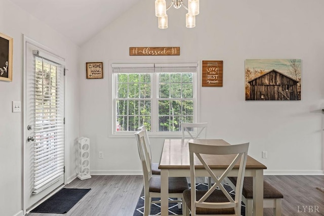 208 Samson Way, Madison Heights, VA 24572 - dining area featuring a chandelier, lofted ceiling, plenty of natural light, and wood finished floors