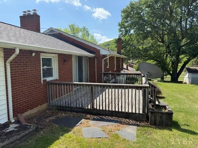 wooden terrace with a lawn