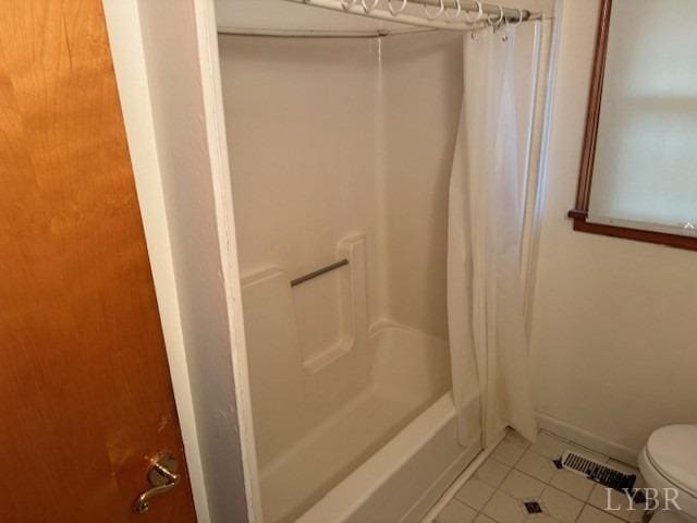 bathroom with tile patterned flooring, shower / tub combo with curtain, visible vents, and toilet