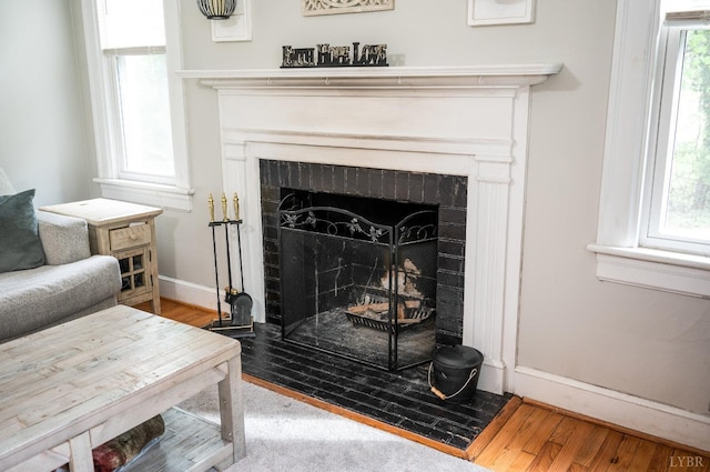 4205 Tremont, Lynchburg, VA 24502 - detailed view of a brick fireplace, wood finished floors, and baseboards