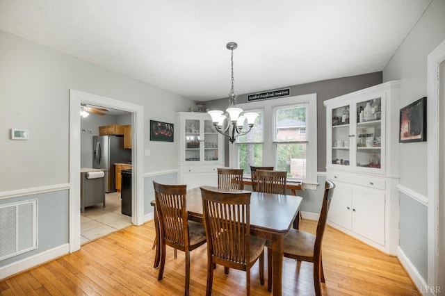 4205 Tremont, Lynchburg, VA 24502 - dining area featuring light wood finished floors, a chandelier, and baseboards