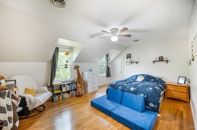 4205 Tremont, Lynchburg, VA 24502 - bedroom featuring wood finished floors, a textured ceiling, lofted ceiling, and a ceiling fan