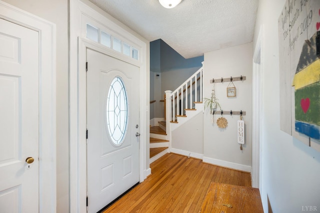 4205 Tremont, Lynchburg, VA 24502 - entryway with light wood-style floors, stairs, a textured ceiling, and baseboards