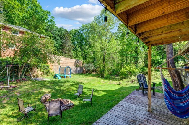 4205 Tremont, Lynchburg, VA 24502 - view of yard featuring a wooden deck, a fire pit, and a playground