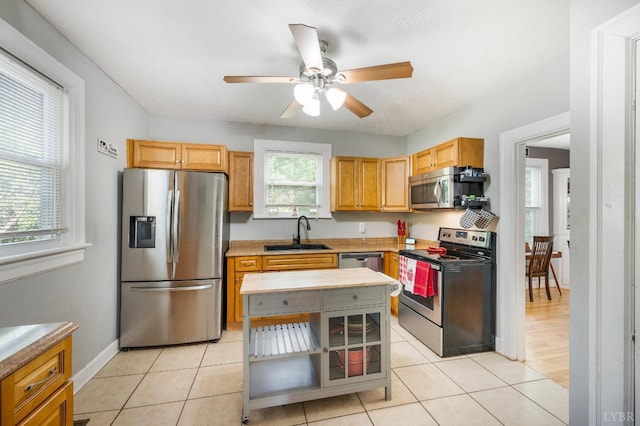 4205 Tremont, Lynchburg, VA 24502 - kitchen with appliances with stainless steel finishes, a sink, ceiling fan, light countertops, and open shelves