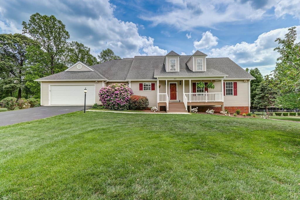 183 Fernridge Ct, Madison Heights, VA 24572 - new england style home with asphalt driveway, covered porch, a garage, and a shingled roof