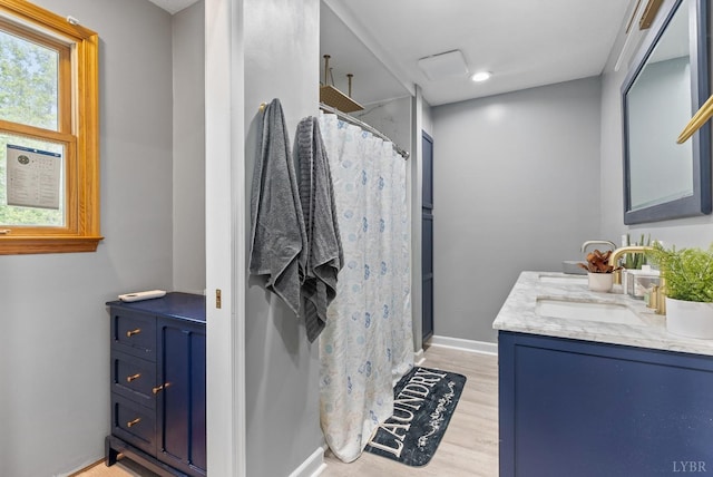 95 Rhage Ln, Lynchburg, VA 24504 - full bath featuring double vanity, a shower with curtain, wood finished floors, and baseboards