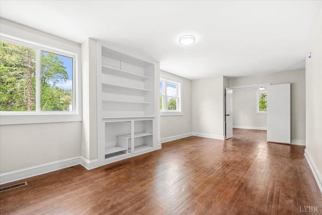 3882 Peakland Pl, Lynchburg, VA 24503 - unfurnished living room with wood finished floors, baseboards, and built in shelves