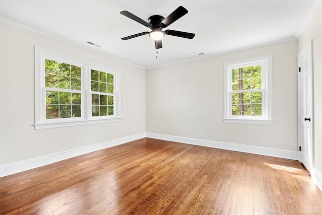 3882 Peakland Pl, Lynchburg, VA 24503 - empty room with plenty of natural light, hardwood / wood-style flooring, baseboards, crown molding, and a ceiling fan