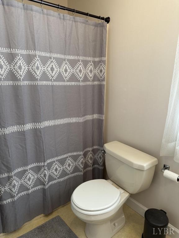 69 Gough Rd, Rustburg, VA 24588 - full bathroom with toilet, baseboards, tile patterned floors, and a shower with curtain