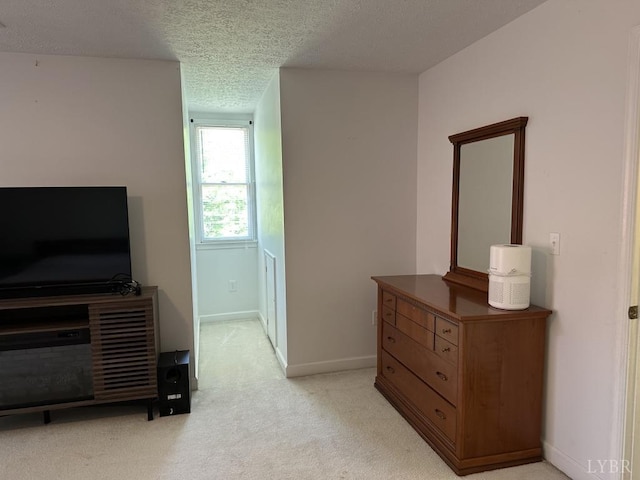 69 Gough Rd, Rustburg, VA 24588 - bedroom with light colored carpet, a textured ceiling, and baseboards