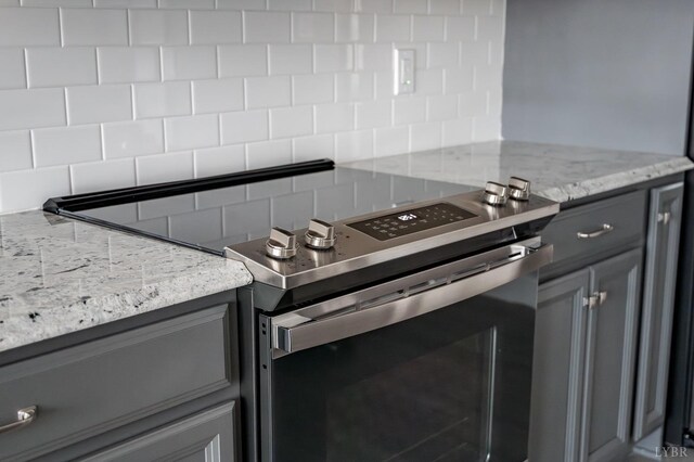 1051 Wills Way, Forest, VA 24551 - kitchen featuring stainless steel electric range oven, gray cabinets, and decorative backsplash