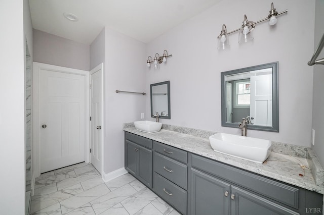 1051 Wills Way, Forest, VA 24551 - bathroom featuring double vanity, marble look tiles, and baseboards