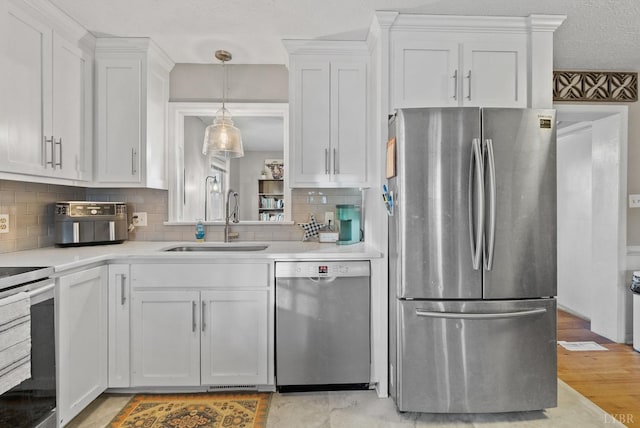 206 Simsbury Ln, Forest, VA 24551 - kitchen with appliances with stainless steel finishes, a sink, light countertops, and white cabinetry
