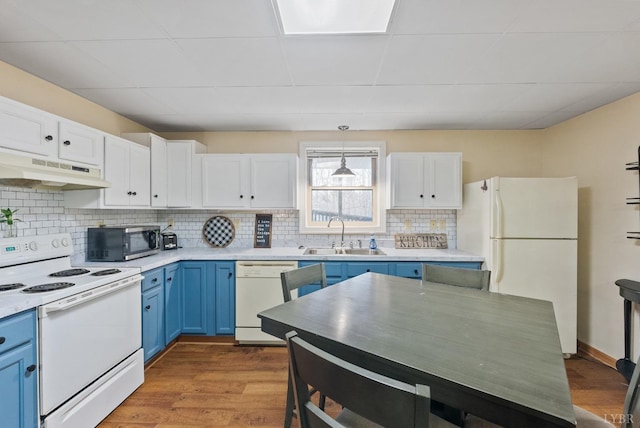 206 Simsbury Ln, Forest, VA 24551 - kitchen with white appliances, under cabinet range hood, blue cabinets, a sink, and white cabinetry