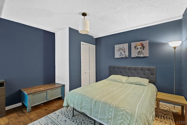 206 Simsbury Ln, Forest, VA 24551 - bedroom with wood finished floors, a closet, a textured ceiling, and baseboards
