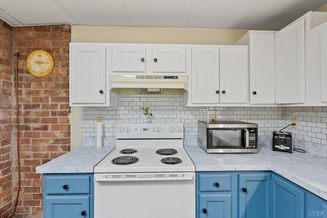 206 Simsbury Ln, Forest, VA 24551 - kitchen with under cabinet range hood, white range with electric cooktop, stainless steel microwave, blue cabinetry, and white cabinetry