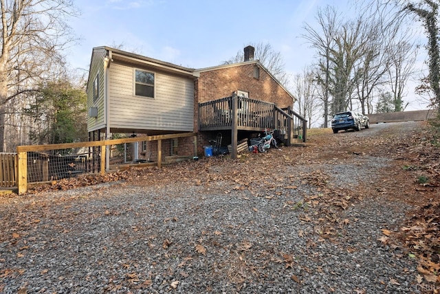 206 Simsbury Ln, Forest, VA 24551 - back of property featuring a chimney, a wooden deck, and brick siding