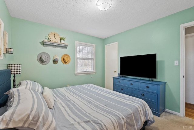 206 Simsbury Ln, Forest, VA 24551 - bedroom featuring a textured ceiling, light colored carpet, and baseboards