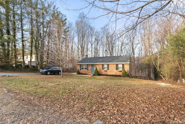 206 Simsbury Ln, Forest, VA 24551 - ranch-style house featuring brick siding, a chimney, and a front yard