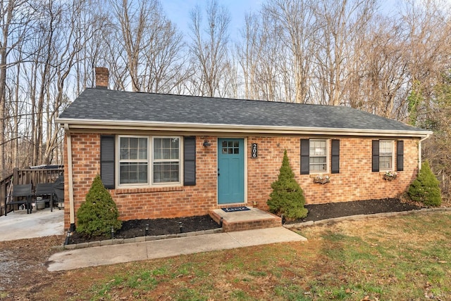 206 Simsbury Ln, Forest, VA 24551 - single story home featuring brick siding, a chimney, a front lawn, and roof with shingles