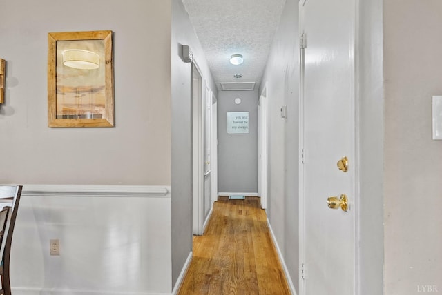 206 Simsbury Ln, Forest, VA 24551 - corridor featuring a textured ceiling, wood finished floors, and baseboards