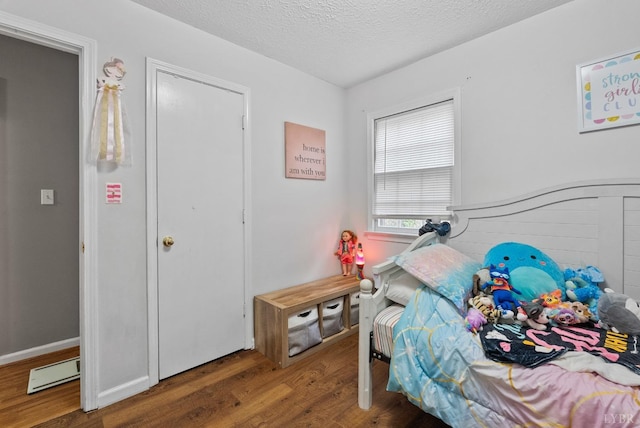 206 Simsbury Ln, Forest, VA 24551 - bedroom featuring wood finished floors and a textured ceiling
