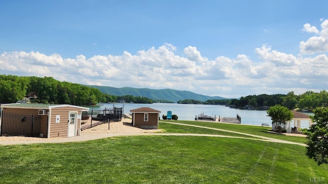 1057 Barrow Hills Dr, Moneta, VA 24104 - view of green lawn with a water and mountain view and a boat dock
