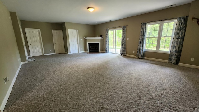 1057 Barrow Hills Dr, Moneta, VA 24104 - unfurnished living room with baseboards, carpet, and a fireplace with flush hearth