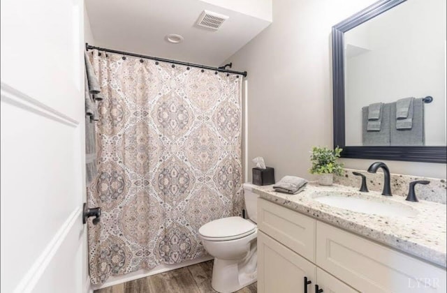 3008 Hill St Unit 313, Lynchburg, VA 24501 - bathroom featuring vanity, wood finished floors, toilet, and a shower with curtain