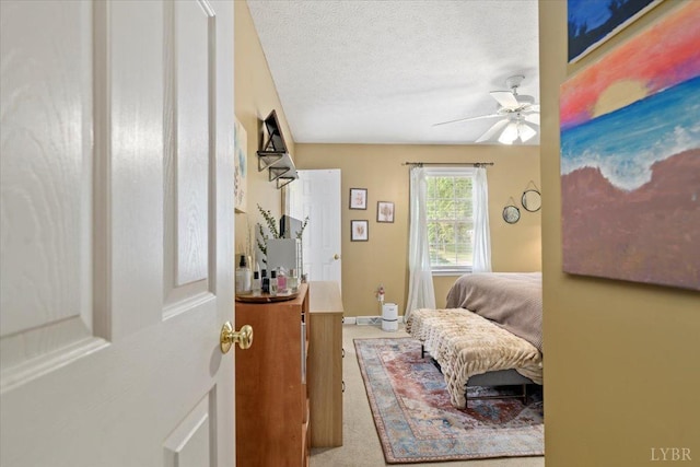 2098 Sunburst Rd, Evington, VA 24550 - bedroom featuring carpet floors, ceiling fan, a textured ceiling, and baseboards