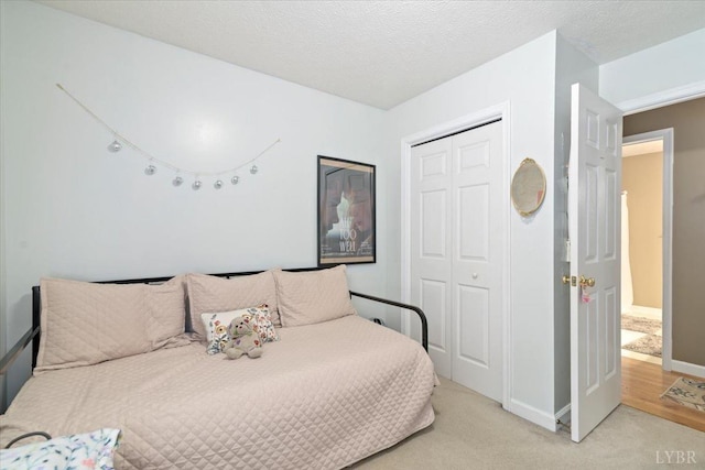 2098 Sunburst Rd, Evington, VA 24550 - bedroom featuring a closet, light carpet, and baseboards