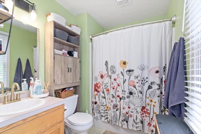 2098 Sunburst Rd, Evington, VA 24550 - full bathroom featuring toilet, vanity, and curtained shower