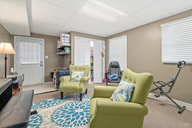 2098 Sunburst Rd, Evington, VA 24550 - carpeted living room with a paneled ceiling and baseboards