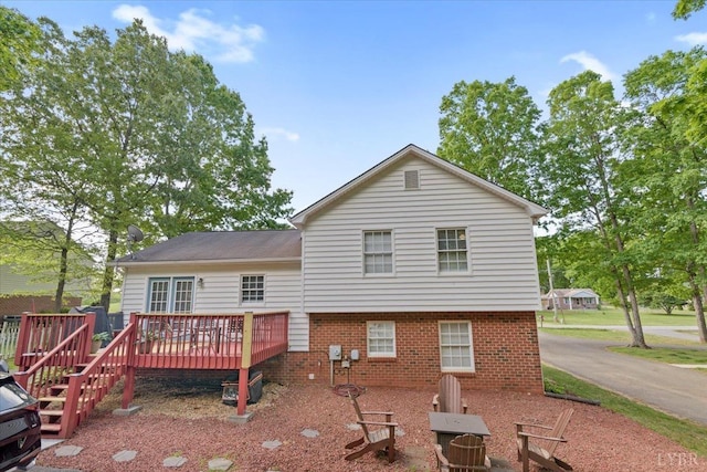 2098 Sunburst Rd, Evington, VA 24550 - rear view of house featuring a deck and brick siding