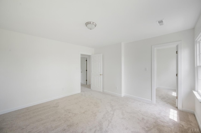 302 Spring Lake Rd, Forest, VA 24551 - spare room featuring visible vents, baseboards, and light carpet