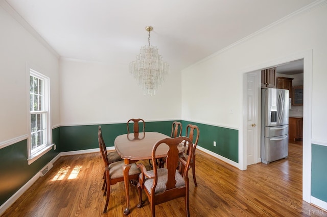 302 Spring Lake Rd, Forest, VA 24551 - dining room with crown molding, visible vents, an inviting chandelier, wood finished floors, and baseboards