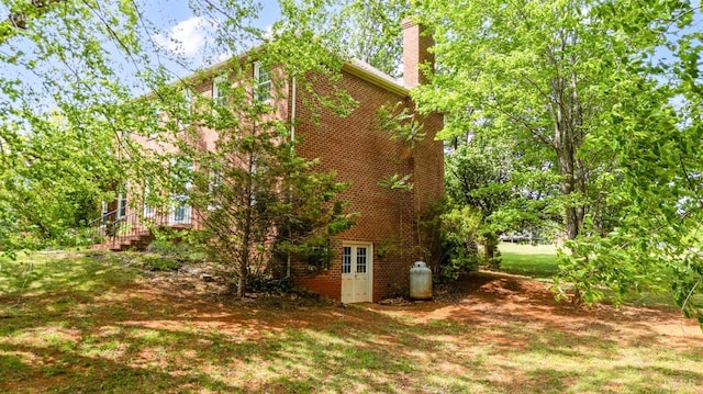 302 Spring Lake Rd, Forest, VA 24551 - view of side of home with brick siding and a chimney