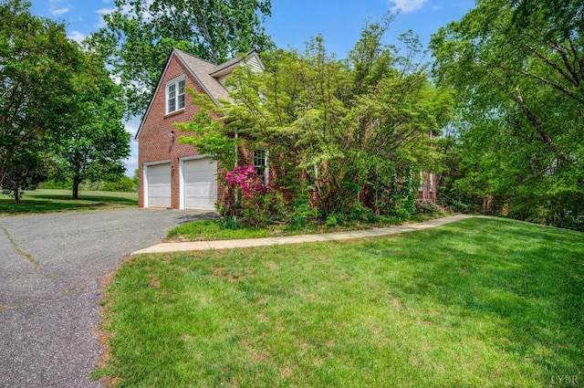 302 Spring Lake Rd, Forest, VA 24551 - view of front facade with an attached garage, driveway, a front lawn, and brick siding