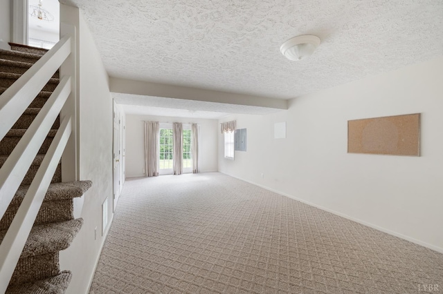 528 Lady Slipper Ln, Lynchburg, VA 24502 - carpeted empty room with a textured ceiling and stairway