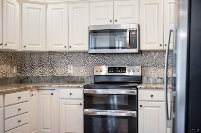 528 Lady Slipper Ln, Lynchburg, VA 24502 - kitchen featuring stainless steel appliances, white cabinets, and tasteful backsplash