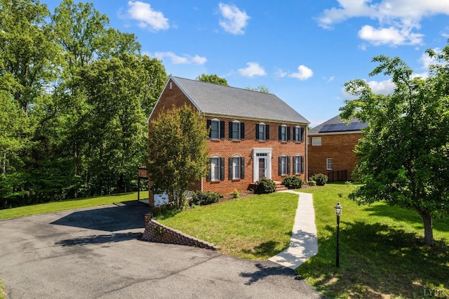 528 Lady Slipper Ln, Lynchburg, VA 24502 - view of front facade with brick siding, a front yard, and asphalt driveway