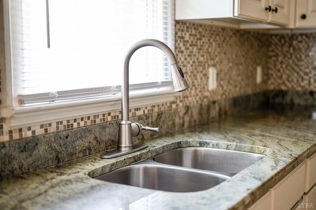 528 Lady Slipper Ln, Lynchburg, VA 24502 - kitchen view of backsplash, light stone countertops, and cream cabinets