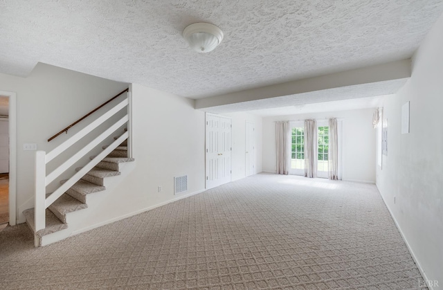 528 Lady Slipper Ln, Lynchburg, VA 24502 - unfurnished living room featuring carpet, stairway, and a textured ceiling