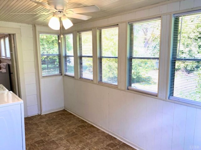 306 Oakridge Blvd, Lynchburg, VA 24502 - unfurnished sunroom with plenty of natural light, wood walls, stone finish flooring, and washer / clothes dryer